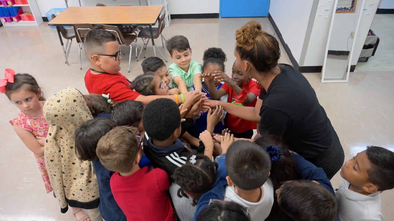 Students with a teacher. Arts For Learning, Miami